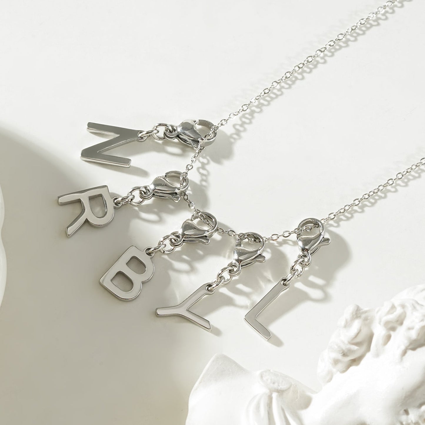 SOLID LETTER MINI CHARMS A–Z in SILVER (White Gold): Dainty Initial Alphabet Pendant for Necklaces & Bracelets — $12.50