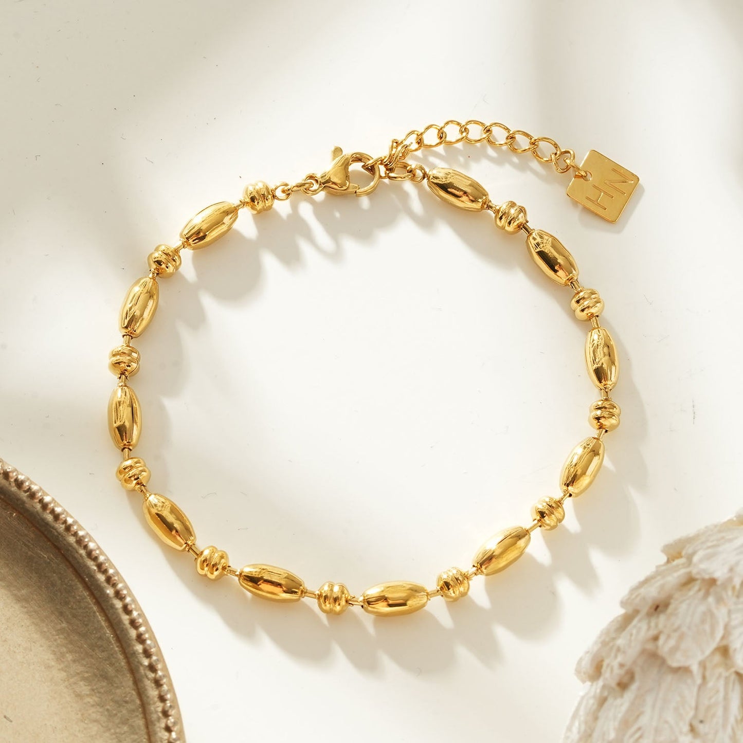 ADIATA Gold: Polished Oval Bead Bracelet – Sculpted Statement Jewellery