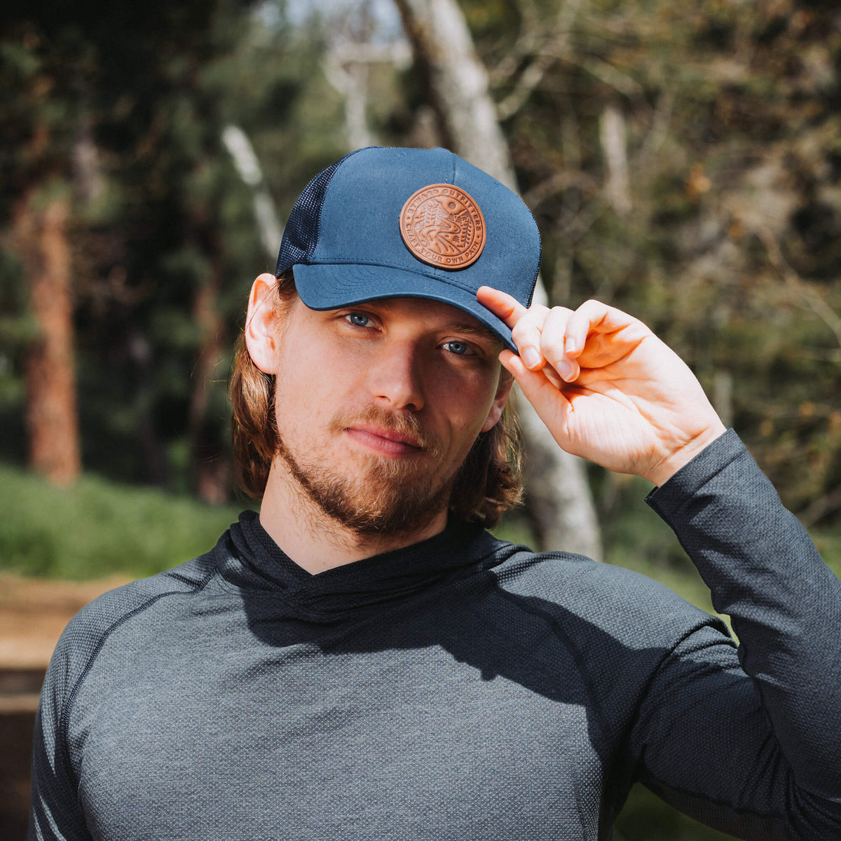 Winding Wilderness Leather Patch Trucker Hat