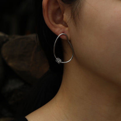 SIMAN Irregular Shaped Pavé Zirconia accented Hoop Earrings in Silver